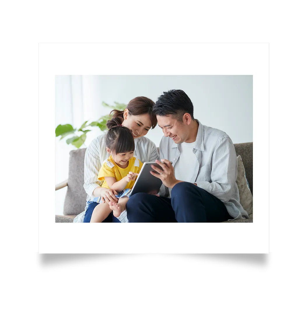Parent and child looking at a tablet together